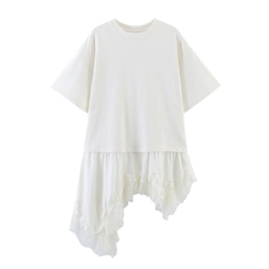 Detailed close-up of asymmetrical lace hem on white casual short sleeve cotton t-shirt