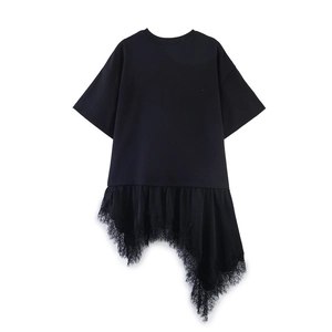 Detail of black t-shirt dress featuring asymmetric hem with tiered eyelash lace trim