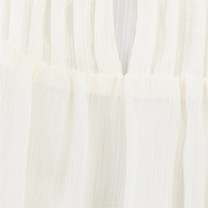 Macro detail of fine vertical pleats on a lightweight white chiffon fashion shirt fabric