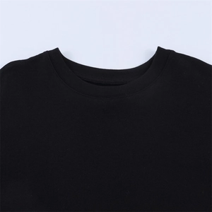 Detail of the crew neckline on a black cotton T-shirt with high-quality ribbed finishing