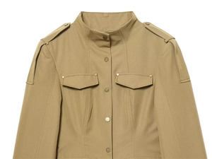 Detail view of khaki military jacket with shoulder epaulets and metal buttons