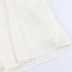 Detail of white semi-transparent chiffon fabric with vertical texture and double-stitched hem