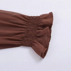 French vintage slim fit long sleeve top with smocked cuffs and ruffled edge details