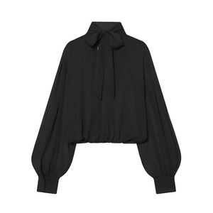 Detail of high neck bow tie and hollow-out design on a black long sleeve chiffon blouse