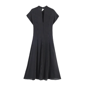 Detailed back view of a high-neck polka dot midi dress showing keyhole button closure