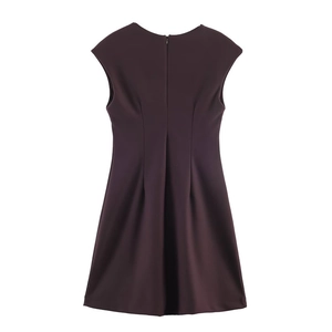 Detail of deep brown sleeveless V-neck dress featuring a hidden back zipper and waist pleats
