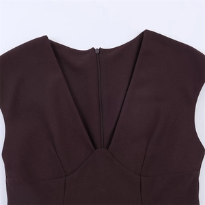 Macro shot of deep V-neckline detail with matching invisible zipper on sleeveless dress