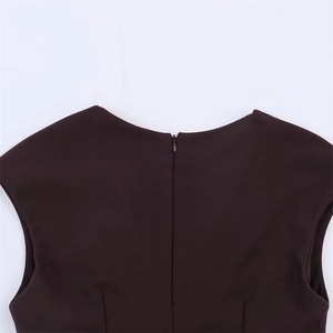 Detail view of the hidden back zipper and deep brown woven fabric on a sleeveless dress