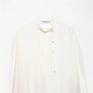 Elegant cream silk long sleeve shirt for women featuring a minimalist buttoned high neck design
