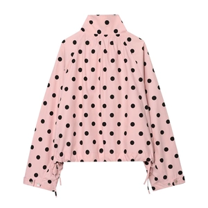 Detail of pink polka dot lightweight jacket with high collar and adjustable drawstring cuffs