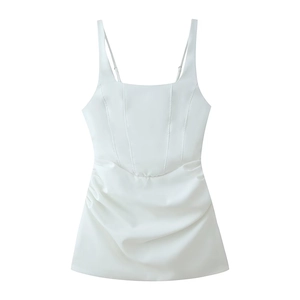 Detail of white satin mini dress featuring thin straps and side ruched pleated texture