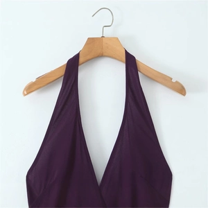 Elegant deep purple halter neck dress featuring a slimming silhouette and sleek design