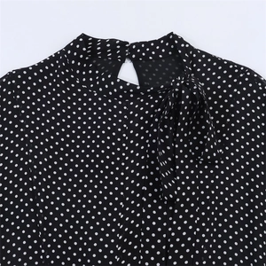 Polka dot midi dress featuring a bow tie high neck and elegant back button closure
