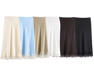Detail of satin midi skirts with delicate lace hem in six versatile solid colors