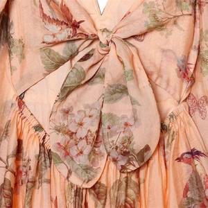 Floral puff sleeve mini dress with tie-front bow design in peach pink vintage print