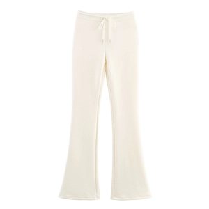 Close-up of cream flare leg casual pants with elastic drawstring waist and soft knit fabric