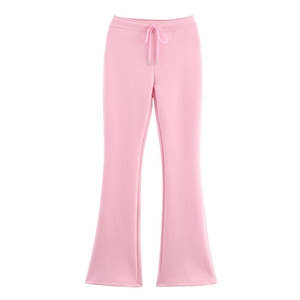 Detail view of pink flare pants featuring drawstring waist and premium metal aglets
