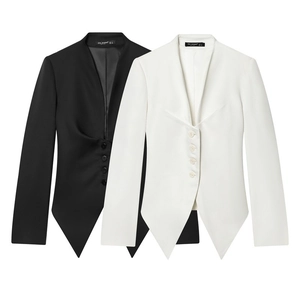 Detail of tailored black and white blazers with asymmetric hems and deep V-necklines
