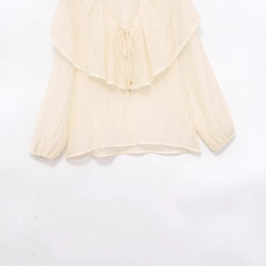 Camicetta beige a maniche lunghe con volant in pizzo e lacci con perline dorate