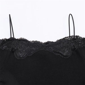 Close-up of black ribbed knit top featuring delicate lace neckline and thin straps