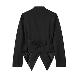 Detail of a black blazer featuring a stylish back bow tie and elegant swallowtail hem