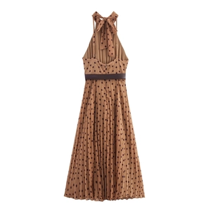 Detailed back view of a brown polka dot halter dress with pleats and a waist belt