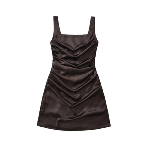 Detail view of dark brown satin dress featuring pleated texture and square neckline