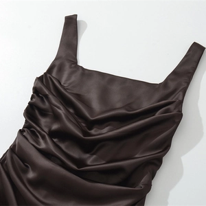 Detail of chocolate satin mini dress featuring square neck and elegant ruched texture