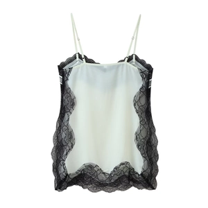 Detail of white camisole with black lace trim and adjustable spaghetti straps