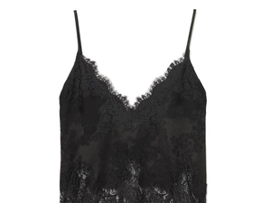 Detail of elegant black lace trim on a V-neck satin camisole top with eyelash edges