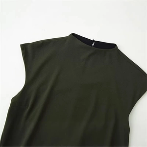 Deep green crepe texture dress detail with back neck button and minimalist high collar design