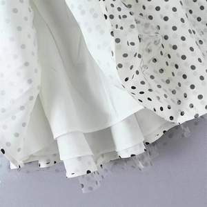 Sleeveless polka dot mesh halter dress with layered ruffle skirt and smooth lining
