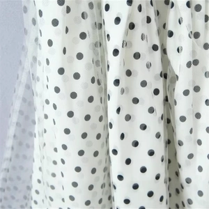 Chic white mesh halter dress featuring black polka dots and double-layered fabric