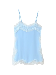 Detail of light blue camisole top featuring delicate white lace trim and satin texture