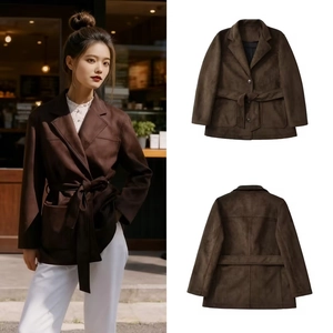 Detail view of coffee brown faux suede blazer featuring a waist belt and flap pockets