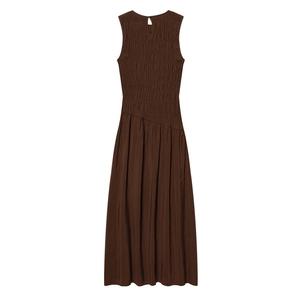 Detail of dark brown sleeveless dress featuring ruched bodice and asymmetric waist design