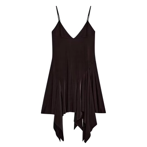 Detail of dark satin dress showing delicate straps and asymmetric draped fold texture