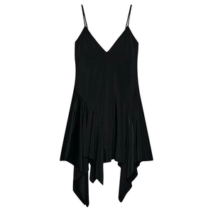 Detail of black asymmetric slip dress with thin straps and ruffled hemline