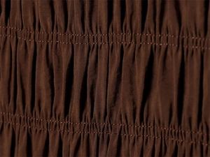 Detailed macro view of dark brown smocked fabric with elastic shirred texture detail
