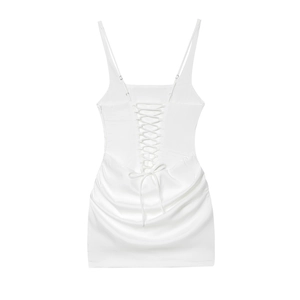 Detailed back view of white satin mini dress featuring lace-up design and ruched hem