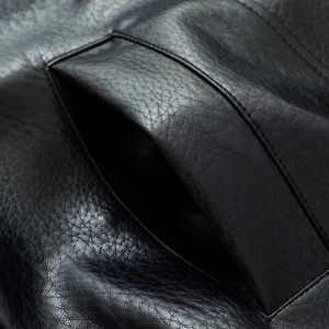 Detailed close-up showing black faux leather texture and neat stitching on side pockets