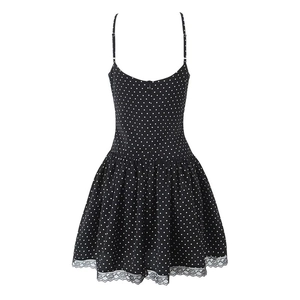 Sleeveless black and white polka dot mini dress with lace hem and thin straps