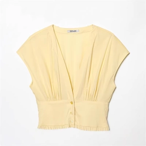Pale yellow V-neck poplin mini dress with pleated waist and button-down front details