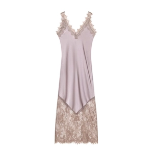 Detail of lavender satin dress featuring delicate eyelash lace trim and hem textures