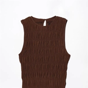 Sleeveless smocked texture dress in dark brown with a minimalist round neckline