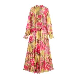 Elegant floral pleated maxi dress with long sleeves and colorful abstract flower patterns