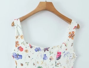 Detail of square neckline and back invisible zipper on a white floral print dress