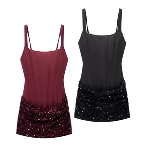Detail view of corset-style bodycon dress featuring sequin patchwork in wine and black colors