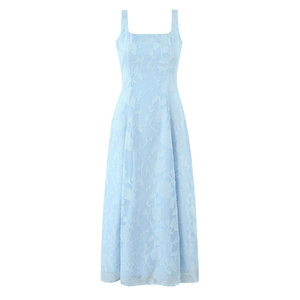 Close-up of light blue jacquard fabric with textured floral patterns on a sun dress