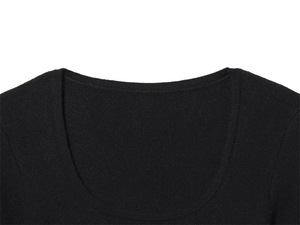 Detail view of the deep U-neckline on a soft black knitted short-sleeved top for women